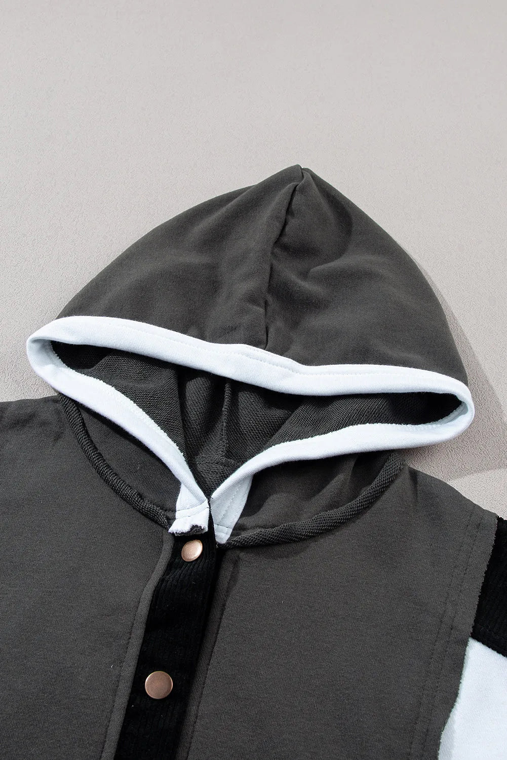 Black Color Block Exposed Seam Buttoned Neckline Hoodie - Chic Meadow Boutique 