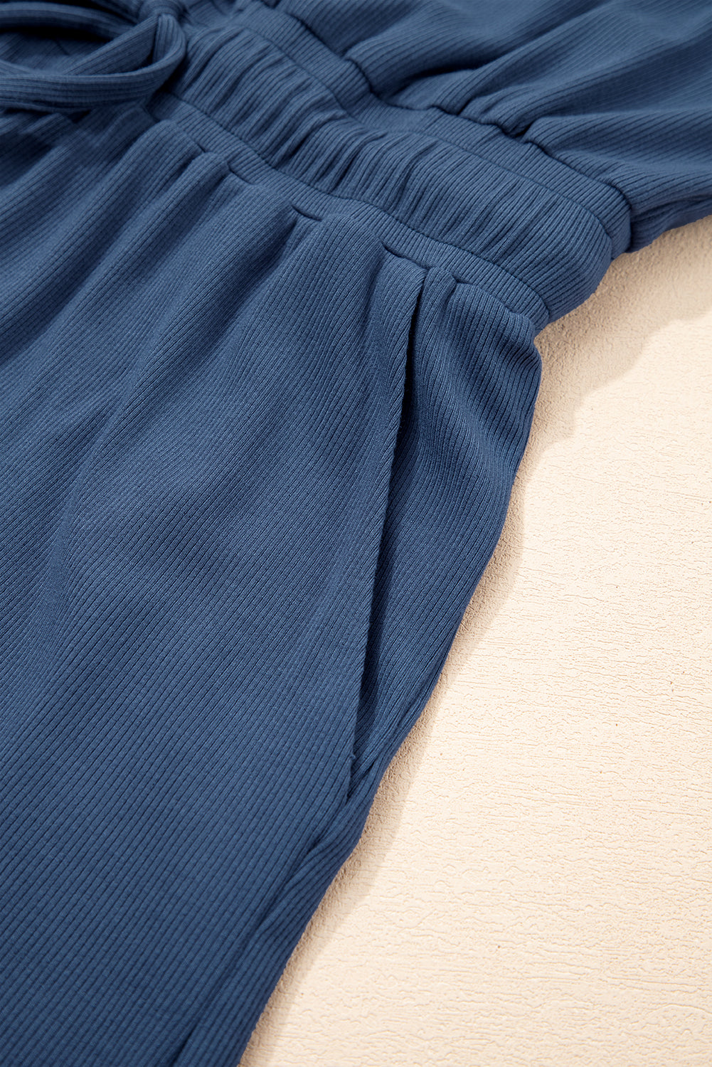 Ashleigh Blue Knit Open Back Cap Sleeve Drawstring Romper