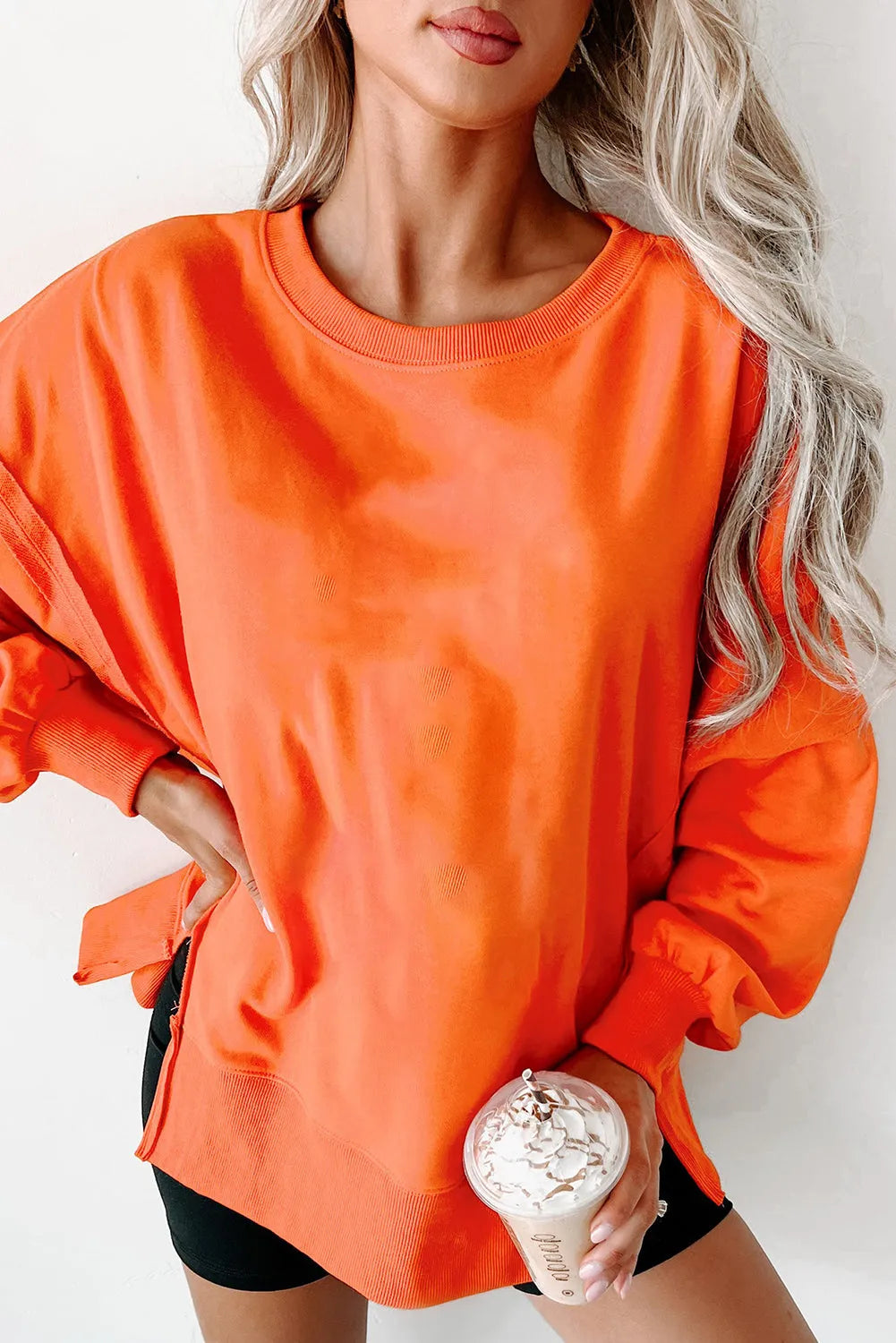 Carrot Exposed Seam Drop Shoulder Round Neck Sweatshirt with Slits - Chic Meadow Boutique 