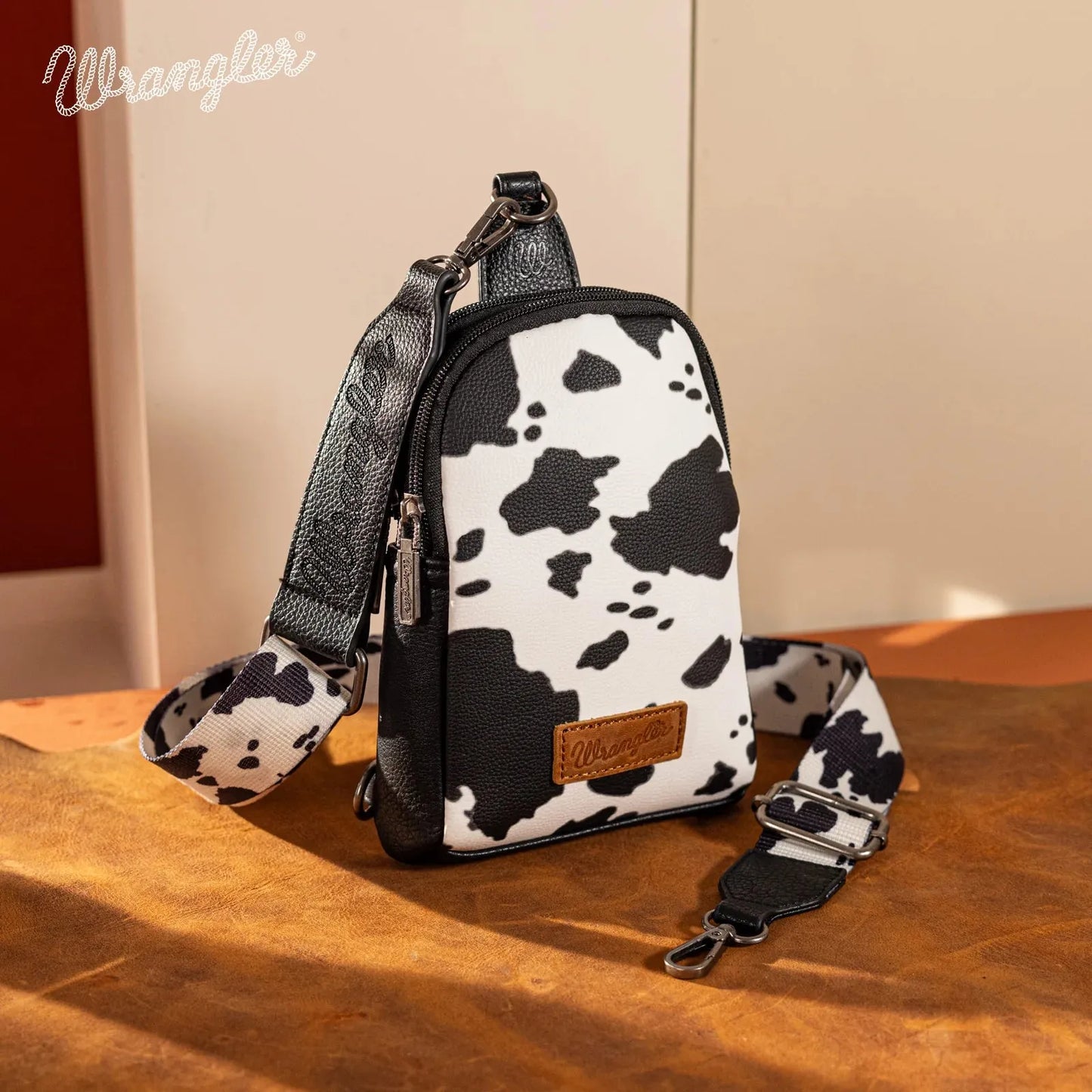 Wrangler Cow Print Crossbody Sling Chest Bag - Black - Chic Meadow Boutique 