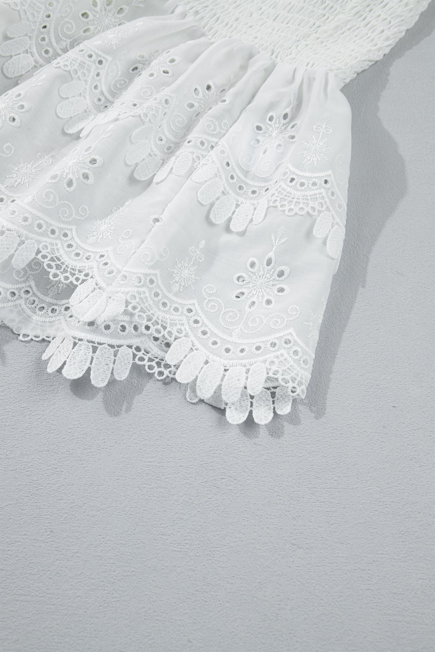 White Sleeveless Smocked Lace Peplum Top
