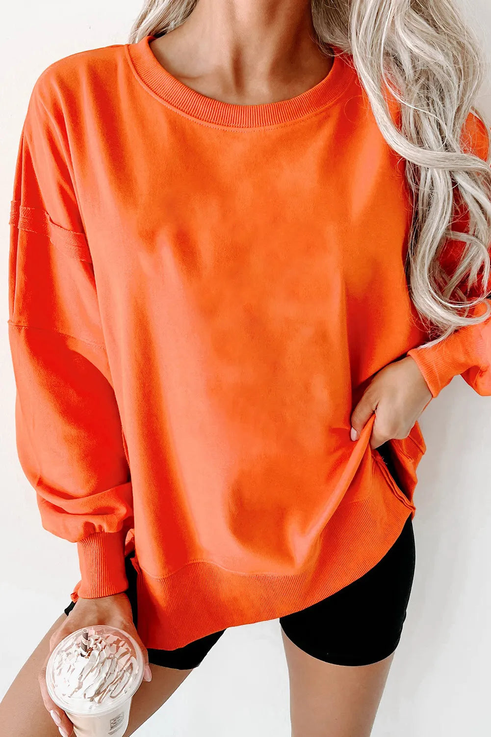 Carrot Exposed Seam Drop Shoulder Round Neck Sweatshirt with Slits - Chic Meadow Boutique 