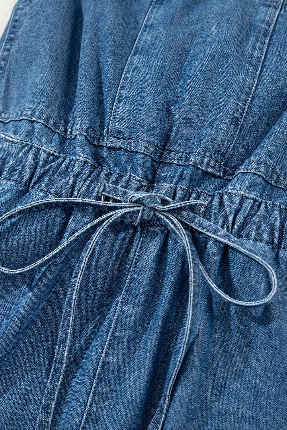 Sky Blue Buckle Straps Bib Style Drawstring Tied Backless Flared Denim Romper