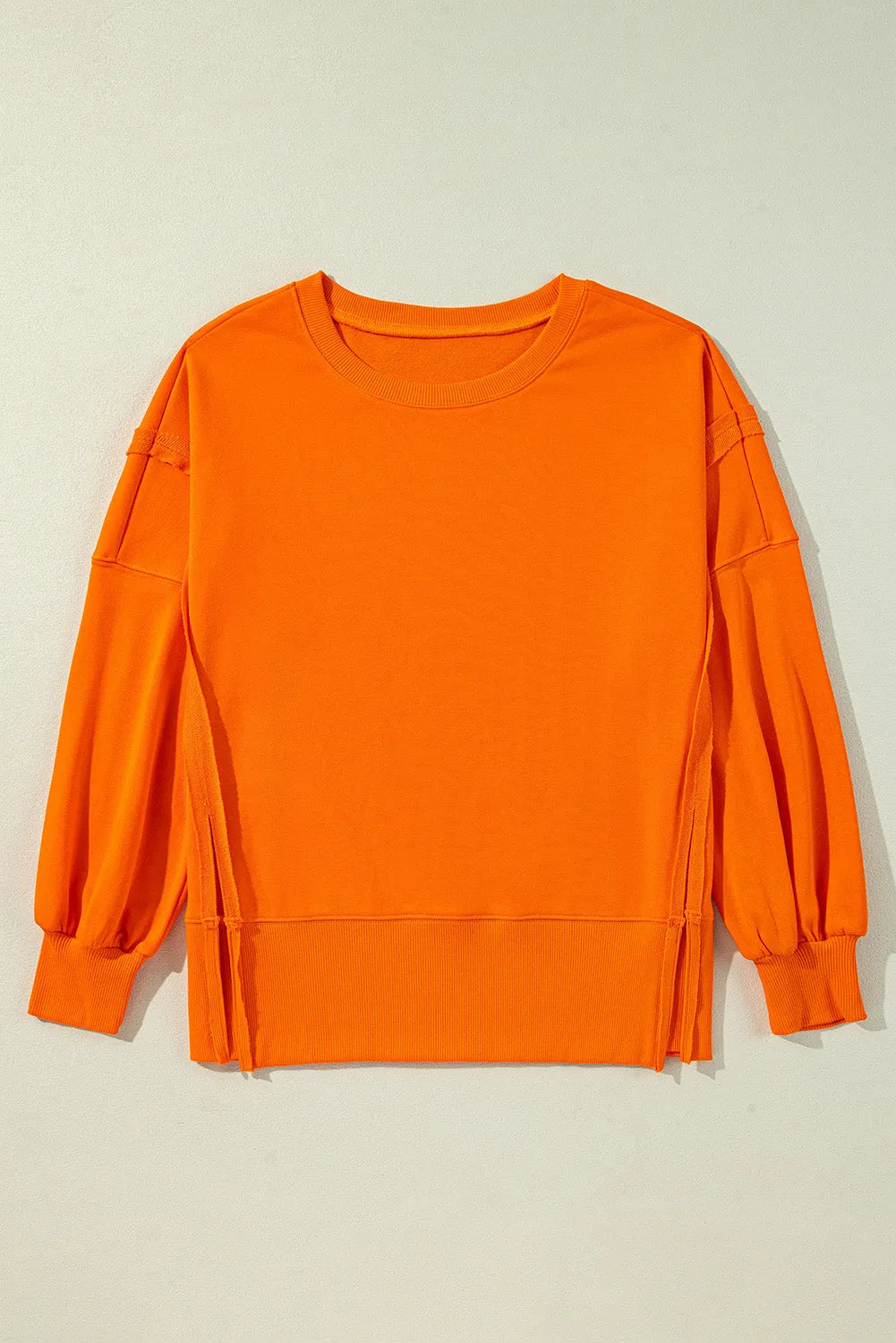 Carrot Exposed Seam Drop Shoulder Round Neck Sweatshirt with Slits - Chic Meadow Boutique 