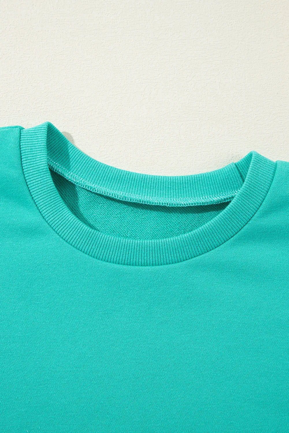 Aruba Blue Solid O Neck High Low Hem Pullover Sweatshirt - Chic Meadow Boutique 