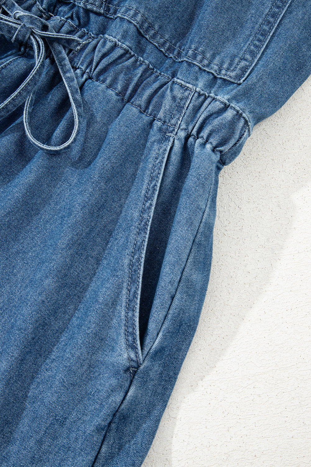 Sky Blue Buckle Straps Bib Style Drawstring Tied Backless Flared Denim Romper