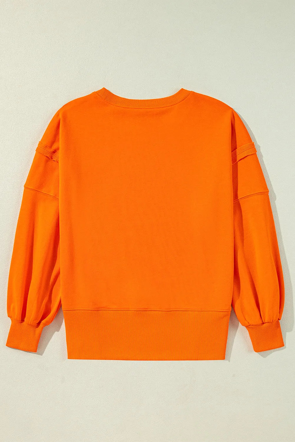 Carrot Exposed Seam Drop Shoulder Round Neck Sweatshirt with Slits - Chic Meadow Boutique 