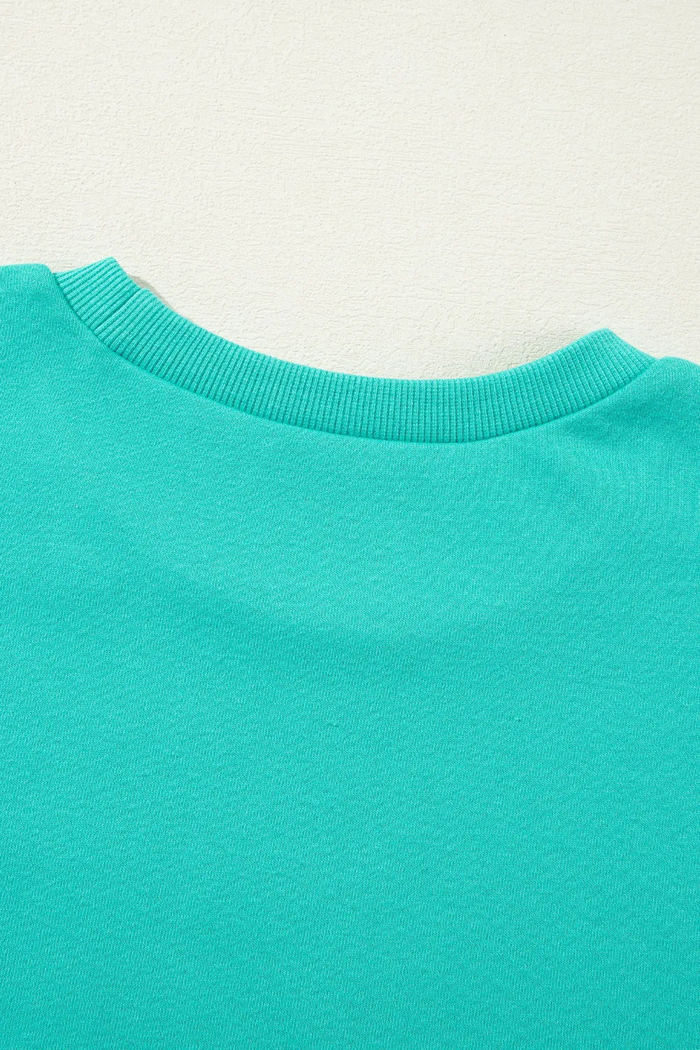 Aruba Blue Solid O Neck High Low Hem Pullover Sweatshirt - Chic Meadow Boutique 