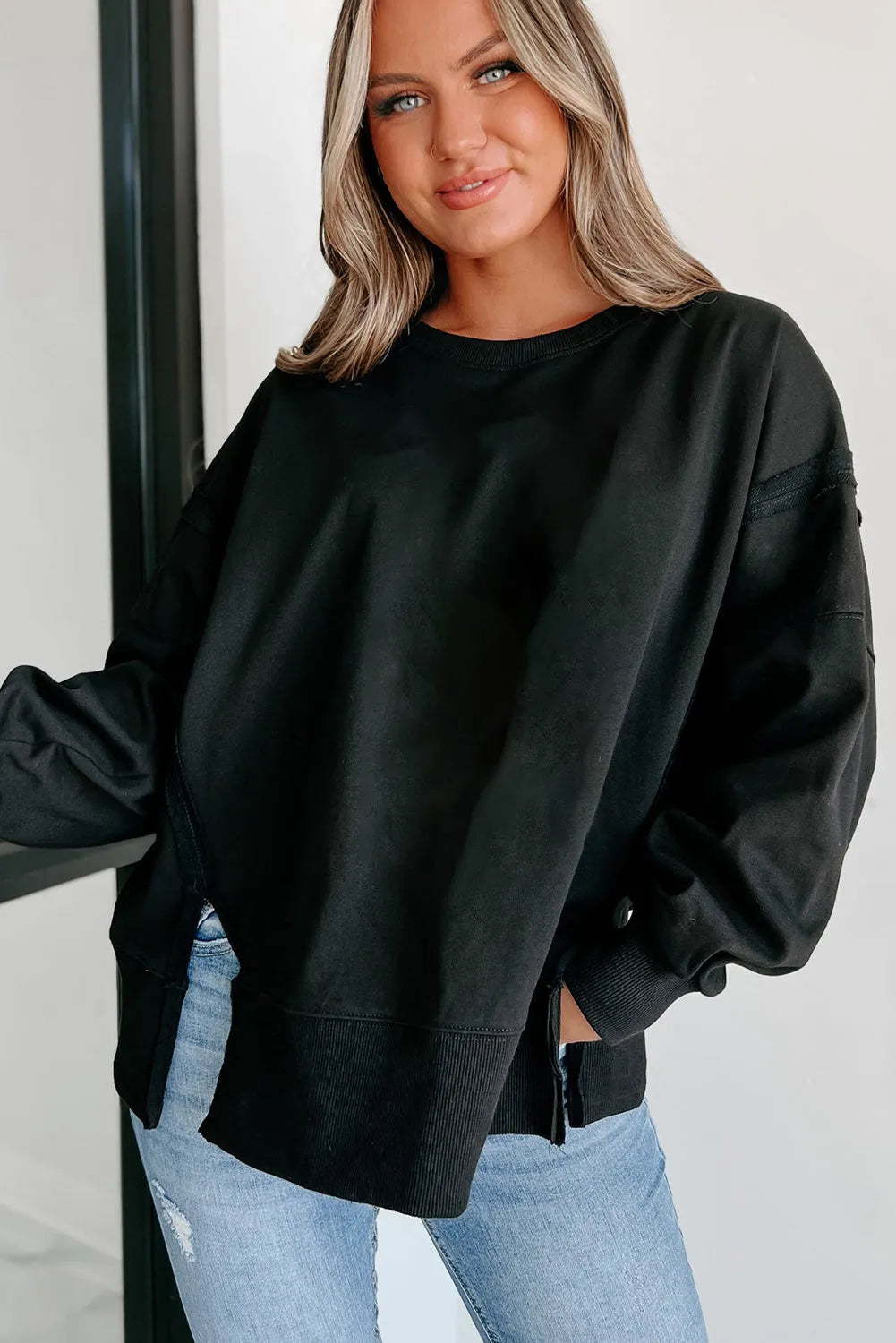 Black Exposed Seam Drop Shoulder Round Neck Sweatshirt with Slits - Chic Meadow Boutique 