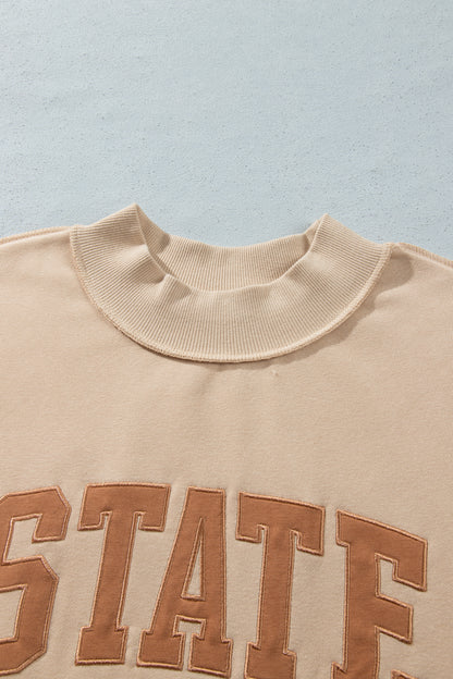 Parchment Exposed Seam Mock Neck STATE Letter Graphic Loose Sweatshirt