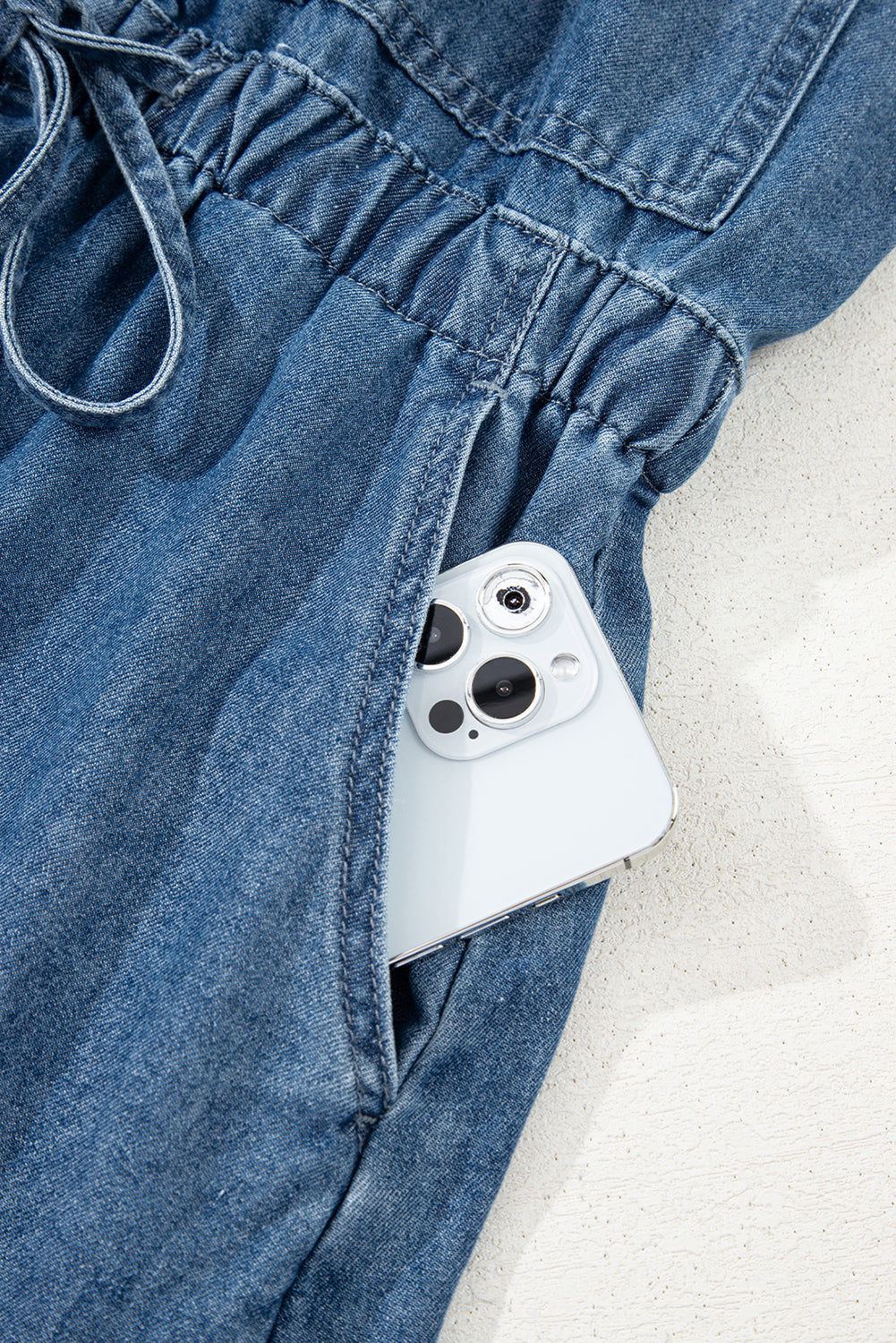 Sky Blue Buckle Straps Bib Style Drawstring Tied Backless Flared Denim Romper