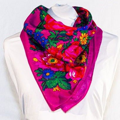 Elegant pink floral scarf with intricate yellow, green and blue flower patterns